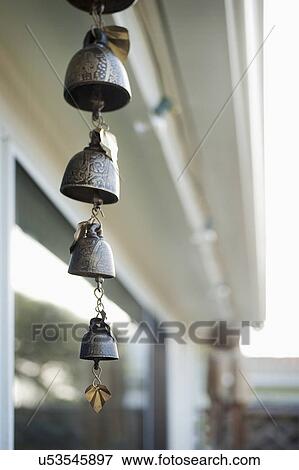 Stock Photo - Wind chime hanging at porch. Fotosearch
