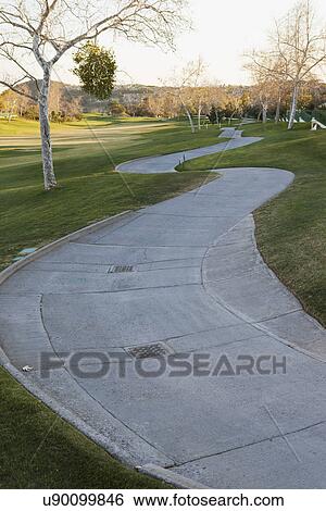 Winding sidewalk through golf course; Trabuco Canyon; California; USA View Large Photo Image Stock Photograph - Winding sidewalk through golf course; Trabuco Canyon; California; USA. Fotosearch