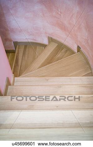 Stock Image - Winding wooden staircase. Fotosearch