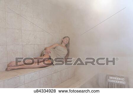 Woman in steam room View Large Photo Image Stock Photo - Woman in steam room. Fotosearch