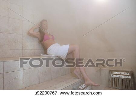 Woman in steam room View Large Photo Image Stock Photo - Woman in steam room. Fotosearch