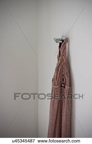 Stock Photo - Women's nightshirt hanging on hook; Hollywood; California; USA. Fotosearch