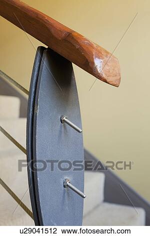 Stock Image - Wood and wire railing going down staircase; Burbank; California; USA. Fotosearch