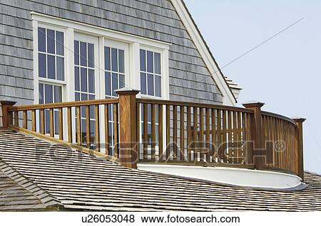 Wooden balcony railing and shingled roof View Large Photo Image Stock Photo - Wooden balcony railing and shingled roof. Fotosearch