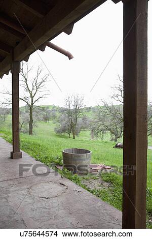 Wooden barrel to catch rain water from drain pipe; Porterville; California; USA View Large Photo Image Picture - Wooden barrel to catch rain water from drain pipe; Porterville; California; USA. Fotosearch