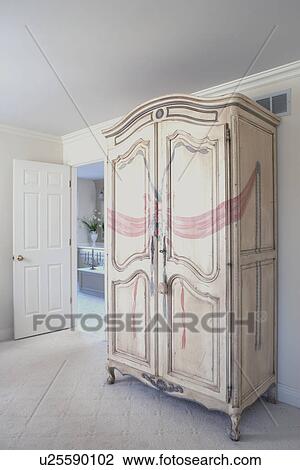 Stock Image - Wooden cupboard in domestic room. Fotosearch