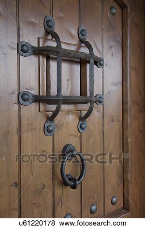 Stock Photo - Wooden door with speakeasy; Bakersfield; California; USA. Fotosearch