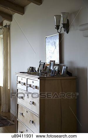 Stock Image - Wooden dresser with open drawer; Carpinteria; California; USA. Fotosearch
