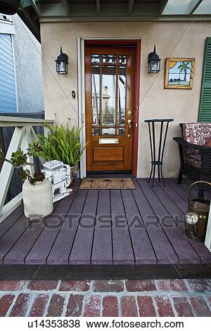 Stock Photo - Wooden front door to middle class home, Laguna Beach, California, USA. Fotosearch