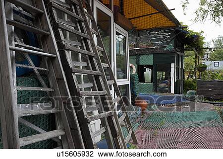 Wooden ladders in front of house with fishing nets floor View Large Photo Image Stock Image - Wooden ladders in front of house with fishing nets floor. Fotosearch