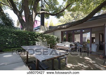 Stock Photo - Wooden table at stone patio; Sydney; Australia. Fotosearch