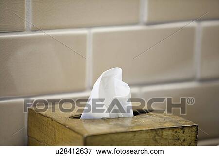Stock Photo - Wooden tissue box in front of tile backsplash; Irvine; California; USA. Fotosearch