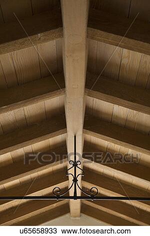 Wrought iron beam supporting wooden ceiling; Carpinteria; California; USA View Large Photo Image Stock Image - Wrought iron beam supporting wooden ceiling; Carpinteria; California; USA. Fotosearch