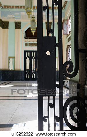 Stock Image - Wrought iron gate detail Bacardi Building in Havana, Cuba. Fotosearch