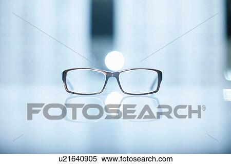 A pair of lone eyeglasses View Large Photo Image Stock Photography - A pair of lone eyeglasses. Fotosearch