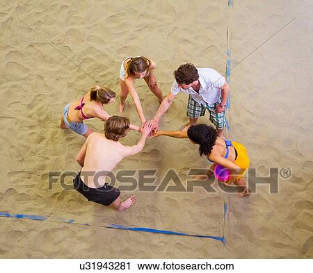 Aerial view of friends team talk at indoor beach volleyball View Large Photo Image Stock Image - Aerial view of friends team talk at indoor beach volleyball. Fotosearch