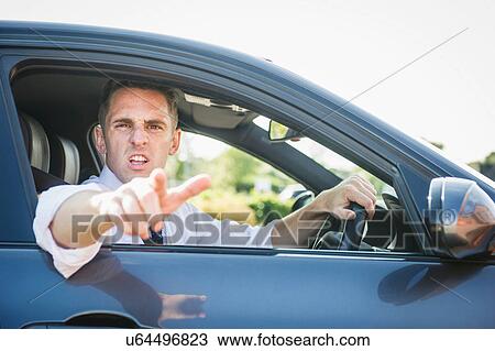 Angry businessman gesturing from car window View Large Photo Image Stock Image - Angry businessman gesturing from car window. Fotosearch