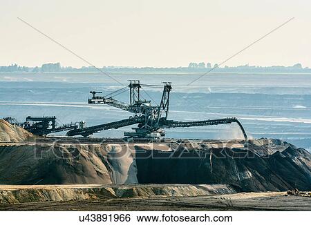Brown coal opencast mine, Juchen, Germany View Large Photo Image Stock Photograph - Brown coal opencast mine, Juchen, Germany. Fotosearch