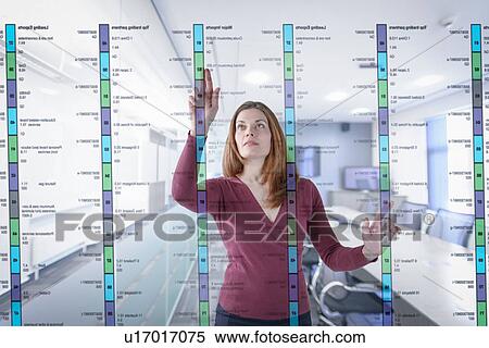 Businesswoman in office using interactive screen View Large Photo Image Stock Photography - Businesswoman in office using interactive screen. Fotosearch