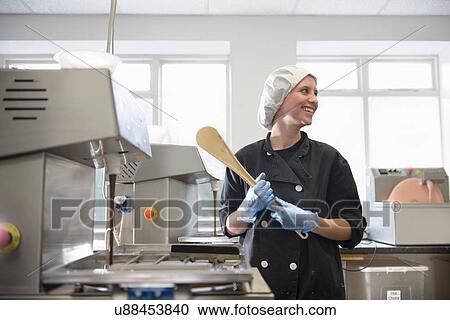 Candid portrait of chocolatier in sweet factory View Large Photo Image Stock Image - Candid portrait of chocolatier in sweet factory. Fotosearch