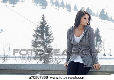 Candid portrait of young female in front of ski hill View Large Photo Image Stock Photograph - Candid portrait of young female in front of ski hill. Fotosearch