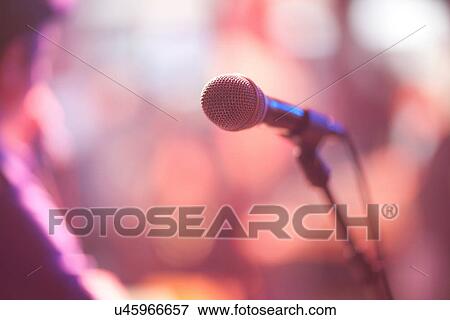 Close up of microphone on stage View Large Photo Image Stock Photo - Close up of microphone on stage. Fotosearch