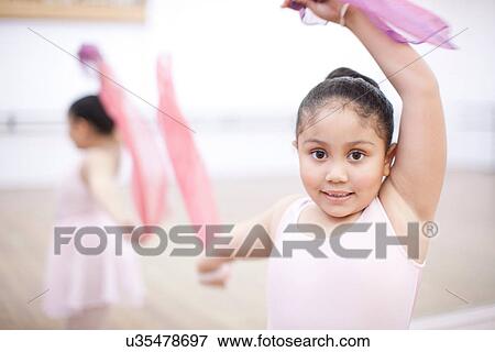 Close up of young ballerina dancing with pink scarves View Large Photo Image Stock Photo - Close up of young ballerina dancing with pink scarves. Fotosearch
