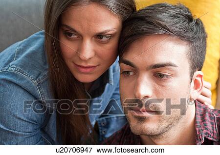 Close up of young couple watching together View Large Photo Image Stock Photo - Close up of young couple watching together. Fotosearch