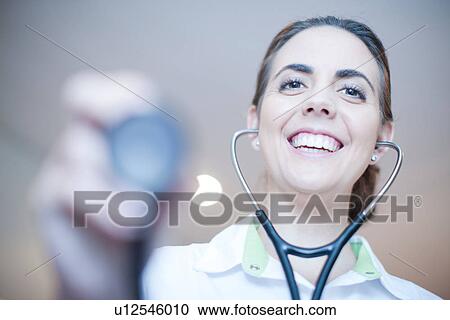 Stock Image - Close up portrait of doctor with stethoscope. Fotosearch