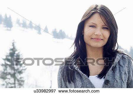 Close up portrait of young female in front of ski hill View Large Photo Image Stock Photo - Close up portrait of young female in front of ski hill. Fotosearch