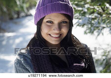 Close up portrait of young female wearing knitted hat View Large Photo Image Picture - Close up portrait of young female wearing knitted hat. Fotosearch