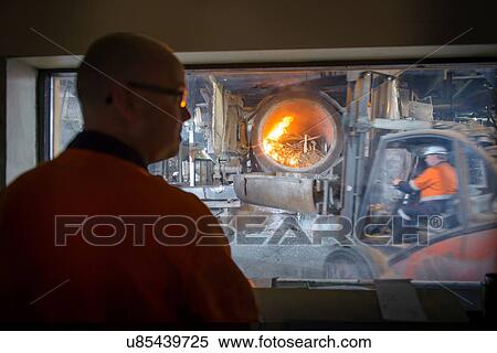 Controller watching furnace at aluminum recycling plant View Large Photo Image Stock Photography - Controller watching furnace at aluminum recycling plant. Fotosearch