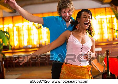 Couple dancing in bar View Large Photo Image Stock Image - Couple dancing in bar. Fotosearch