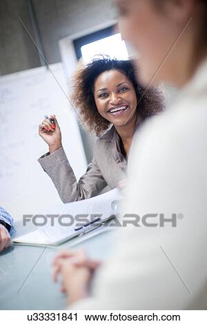 Stock Image - Creative team meeting in office. Fotosearch