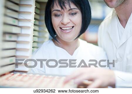 Dental technicians choosing tooth veneers in lab View Large Photo Image Stock Image - Dental technicians choosing tooth veneers in lab. Fotosearch