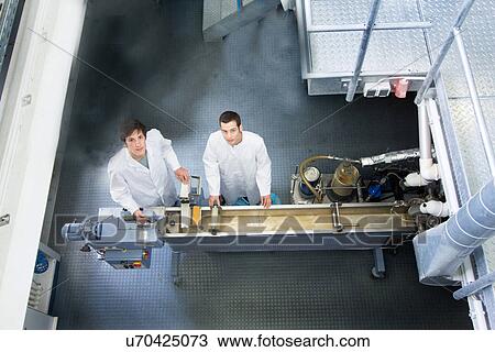 Elevated view of two technicians in working laboratory View Large Photo Image Stock Image - Elevated view of two technicians in working laboratory. Fotosearch