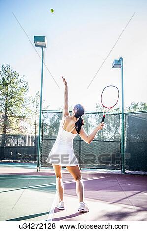 Female tennis player serving View Large Photo Image Stock Photo - Female tennis player serving. Fotosearch