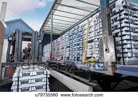 Forklift lifting aluminum ingots onto truck View Large Photo Image Stock Image - Forklift lifting aluminum ingots onto truck. Fotosearch