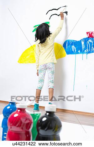 Girl painting ocean and island on wall View Large Photo Image Stock Image - Girl painting ocean and island on wall. Fotosearch