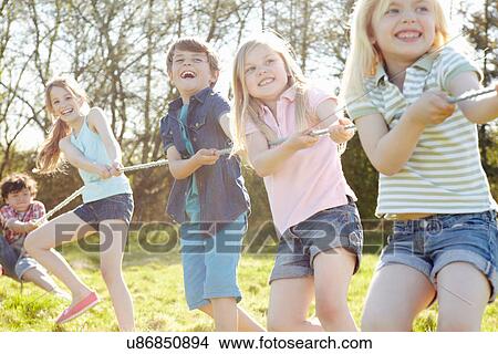 Group of children playing tug o war View Large Photo Image Picture - Group of children playing tug o war. Fotosearch