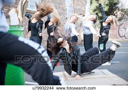 Group of girls breakdancing in carpark View Large Photo Image Picture - Group of girls breakdancing in carpark. Fotosearch