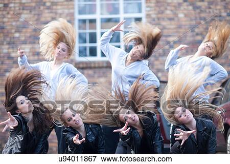Group of girls practicing dance in carpark View Large Photo Image Stock Photo - Group of girls practicing dance in carpark. Fotosearch