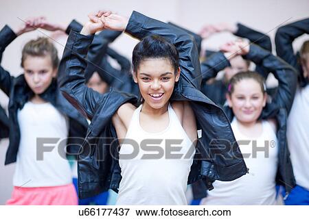Stock Photo - Group of teenagers dancing hip hop in studio. Fotosearch