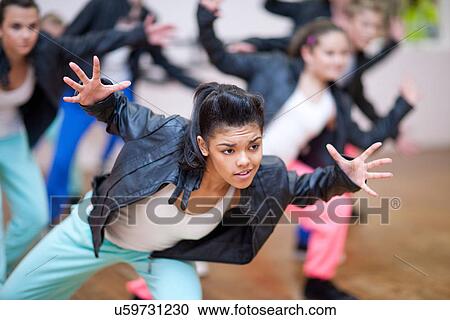 Group of teenagers dancing in studio View Large Photo Image Stock Image - Group of teenagers dancing in studio. Fotosearch
