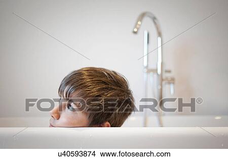 Picture - Head shot of young boy in bath. Fotosearch