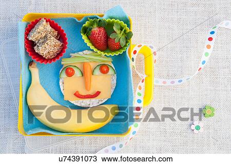 Stock Image - Healthy food products made into smiley face. Fotosearch