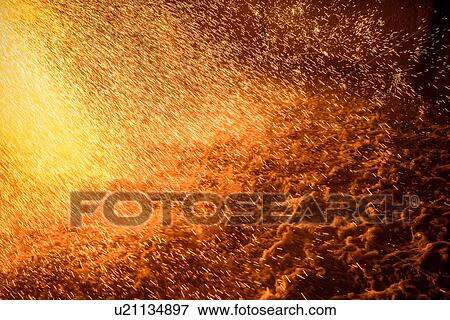 Impact of molten metal poured on water in steel foundry View Large Photo Image Stock Photo - Impact of molten metal poured on water in steel foundry. Fotosearch