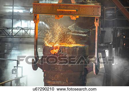 Stock Image - Industrial molten bucket in steel foundry. Fotosearch