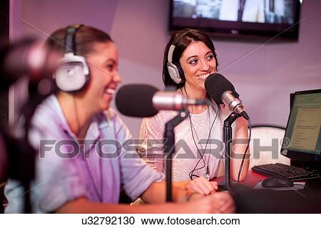 Mid adult and young women broadcasting in recording studio View Large Photo Image Stock Image - Mid adult and young women broadcasting in recording studio. Fotosearch