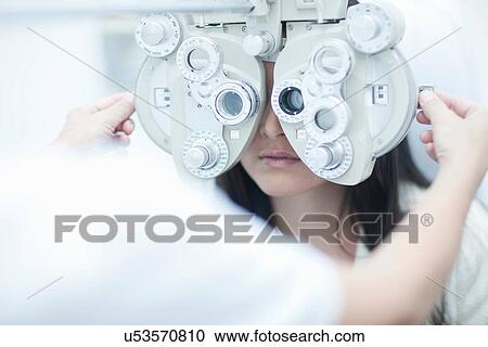 Optician testing patients sight View Large Photo Image Stock Image - Optician testing patients sight. Fotosearch